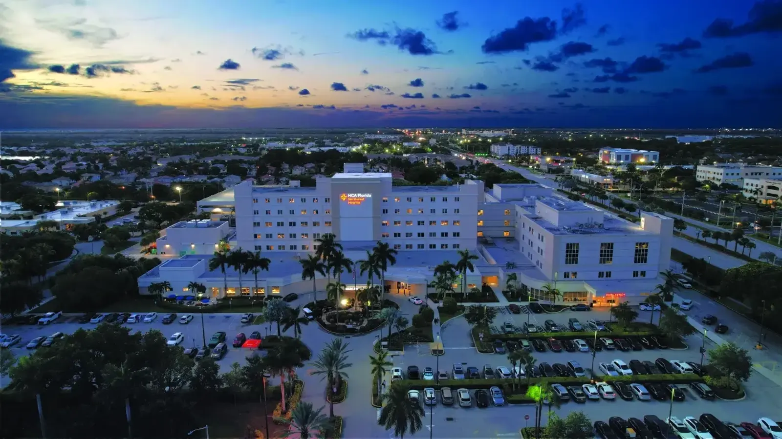 HCA Florida Northwest Hospital exterior in the evening, Margate