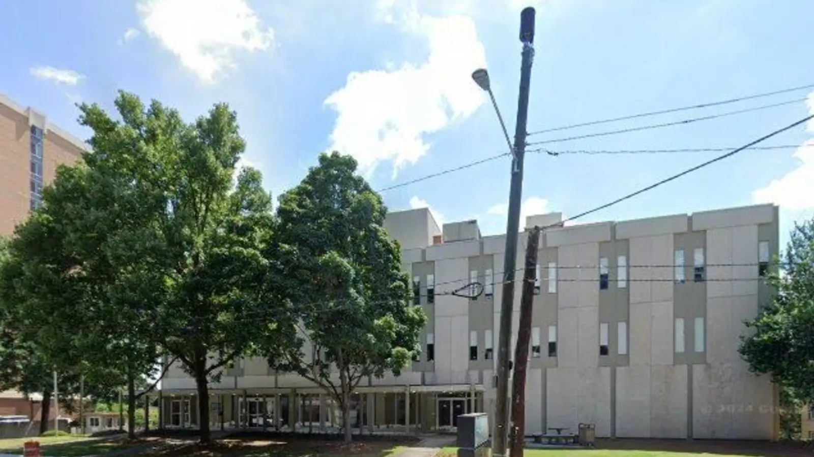 Precast concrete hospital building on Juniper Street seen from the sidewalk