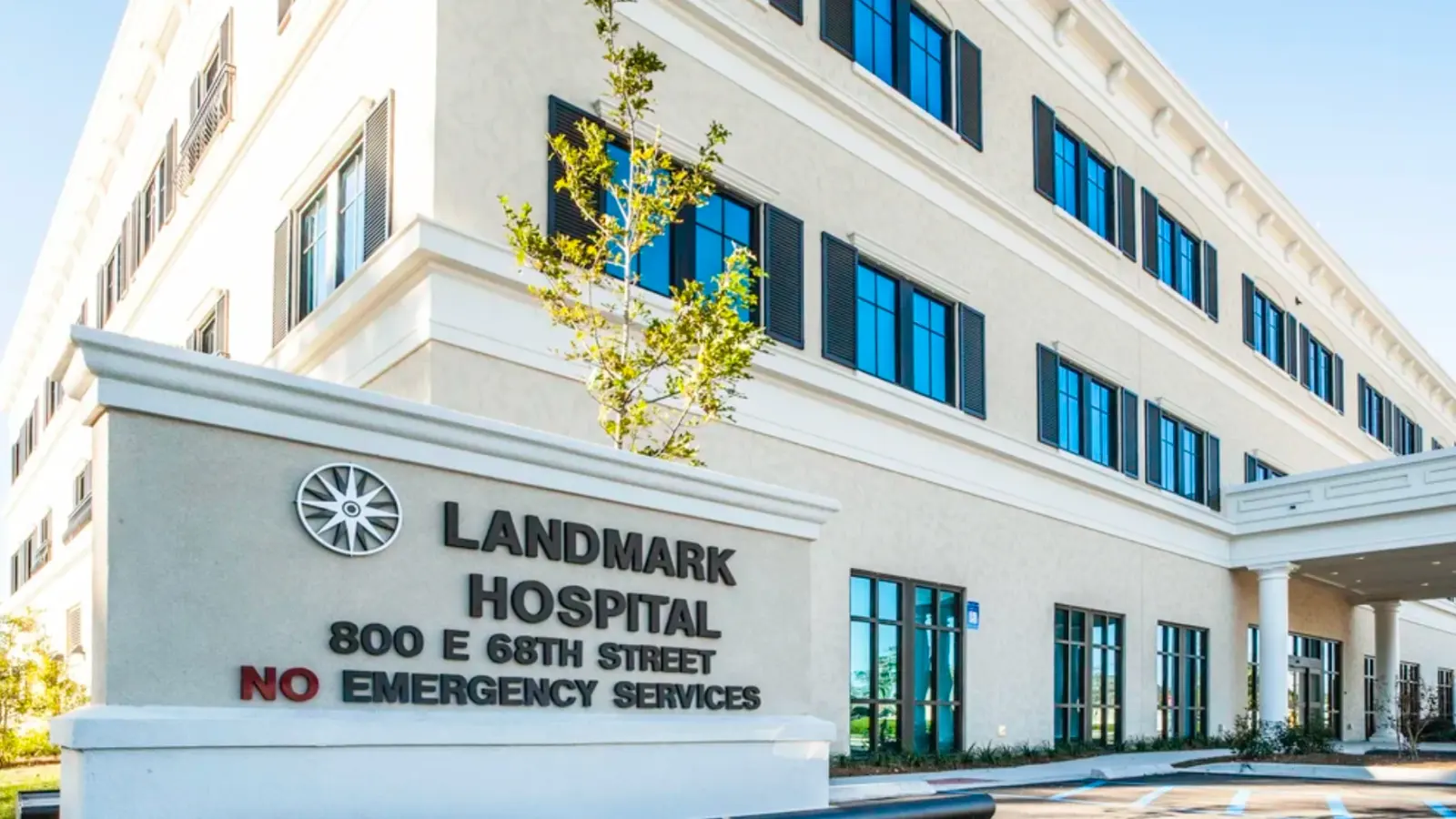 Hospital entrance sign at 800 East 68th Street beside the three-storey facade
